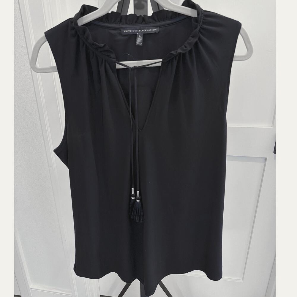 Elegant black sleeveless top White House Black Market ruffled neckline tassels